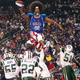 Running back Walter “Snazzy Wiggles” Malone and the Globetrotters football team humiliate their traditional weekly opponents, the New York Jets, for the 449th straight time.